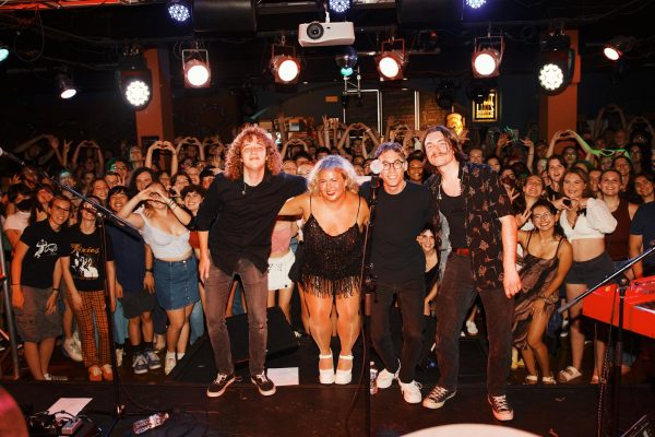 Molly Grace and her band pose with the audience after the show.